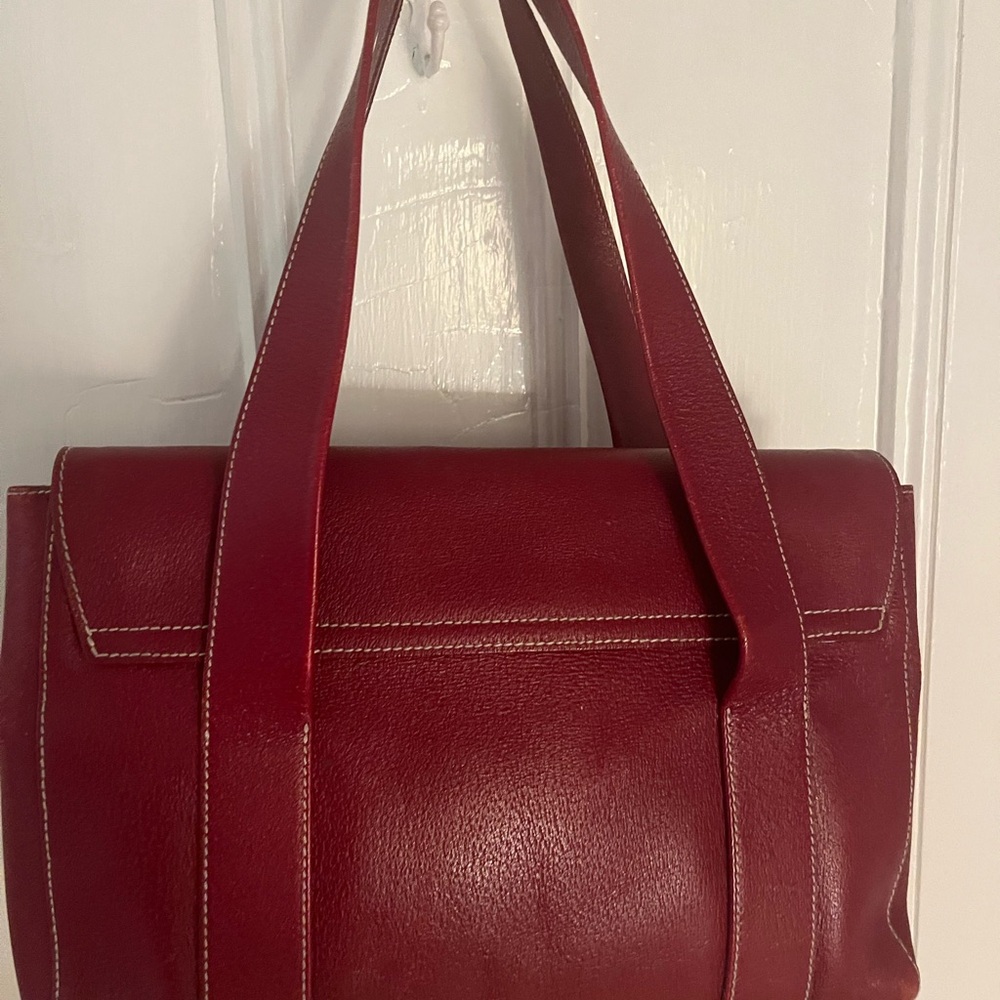 Stylish Red Shoulder Bag with Leather Finish and Structured Design